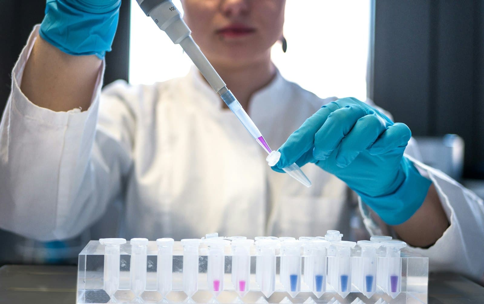 A lab technician testing samples